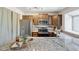 Modern kitchen featuring stainless steel appliances, granite countertops, and wood cabinetry at 9636 W Chatfield Ave # C, Littleton, CO 80128