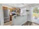 Well-lit kitchen featuring granite countertops and stainless steel appliances at 9636 W Chatfield Ave # C, Littleton, CO 80128