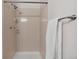 Shower with tile and shower head at 9636 W Chatfield Ave # C, Littleton, CO 80128