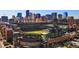 Aerial view of a stadium with the city skyline in the background at 444 17Th St # 701, Denver, CO 80202