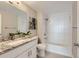 Bathroom featuring granite countertops, bright lighting, and modern fixtures at 444 17Th St # 701, Denver, CO 80202
