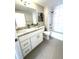 Bathroom featuring granite countertops, bright lighting, and modern fixtures at 444 17Th St # 701, Denver, CO 80202