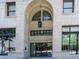 Exterior view of the Midland Lofts building entrance with stone archway at 444 17Th St # 701, Denver, CO 80202