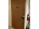 Storage locker 5A's brown door with padlock and fire extinguisher nearby at 444 17Th St # 701, Denver, CO 80202