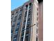 Brick building showcasing its architectural features and multiple floors of windows at 444 17Th St # 701, Denver, CO 80202