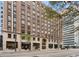 Exterior view of historic brick building with street view and businesses at 444 17Th St # 701, Denver, CO 80202