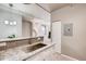 Spacious kitchen with granite countertops, a stainless steel sink, and light wood flooring at 444 17Th St # 701, Denver, CO 80202