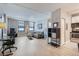 Bright living room features an open layout, with neutral decor, hardwood floors, and large windows at 444 17Th St # 701, Denver, CO 80202