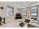 Cozy living room features hardwood floors, large windows, and comfortable seating at 444 17Th St # 701, Denver, CO 80202