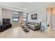 Inviting living room features a sectional sofa, large windows and contemporary decor at 444 17Th St # 701, Denver, CO 80202