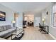 Light-filled living room offers a relaxed space, wood floors, and views of kitchen and dining area at 444 17Th St # 701, Denver, CO 80202
