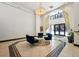 Bright lobby featuring tiled floors, comfortable blue seating, and a modern chandelier at 444 17Th St # 701, Denver, CO 80202