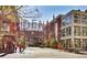 Downtown street with shops, restaurants, and pedestrians at 444 17Th St # 701, Denver, CO 80202
