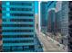 City view, overlooking bustling streets and tall buildings from a unit window at 444 17Th St # 701, Denver, CO 80202