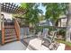 Inviting backyard featuring a deck, patio, and chairs, ideal for relaxation and socializing at 2181 E Phillips Ln, Centennial, CO 80122