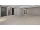 Spacious basement area with light neutral paint, carpet, and stairs leading up to the next floor at 2181 E Phillips Ln, Centennial, CO 80122