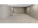 Spacious carpeted basement with neutral tones and closet offers a versatile living space at 2181 E Phillips Ln, Centennial, CO 80122