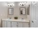 Bright bathroom featuring dual vanities with matching mirrors and fixtures at 2181 E Phillips Ln, Centennial, CO 80122