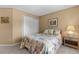 Cozy bedroom featuring neutral-toned walls, carpet, and closet with white doors at 2181 E Phillips Ln, Centennial, CO 80122