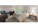 Well-lit bedroom with a plush chair, bookshelves, big windows, and carpet at 2181 E Phillips Ln, Centennial, CO 80122