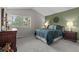 Cozy bedroom with carpet flooring, and soothing green accent wall at 2181 E Phillips Ln, Centennial, CO 80122