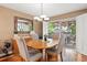 Elegant dining area with access to the outdoor patio and a stylish light fixture at 2181 E Phillips Ln, Centennial, CO 80122