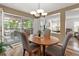 Open dining area with sliding glass door to patio, adjacent to living room at 2181 E Phillips Ln, Centennial, CO 80122