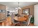 Charming dining area with hardwood floors and seamless flow to the kitchen at 2181 E Phillips Ln, Centennial, CO 80122