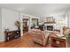 Comfortable living room with a fireplace, plush seating, and hardwood floors at 2181 E Phillips Ln, Centennial, CO 80122