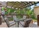 Charming patio with a pergola, dining table, and seating, perfect for outdoor entertaining at 2181 E Phillips Ln, Centennial, CO 80122