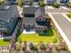 Expansive aerial view highlighting the manicured lawn, patio, and landscaping of this beautiful home at 1135 Basalt Ridge Loop, Castle Rock, CO 80108