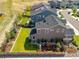 Aerial view of the property featuring a well-maintained lawn and outdoor seating area at 1135 Basalt Ridge Loop, Castle Rock, CO 80108