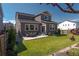 Backyard featuring patio, outdoor seating, green grass, privacy fence and house exterior at 1135 Basalt Ridge Loop, Castle Rock, CO 80108