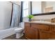 Bathroom featuring a granite vanity top, bathtub, patterned shower curtain and neutral tiling at 1135 Basalt Ridge Loop, Castle Rock, CO 80108