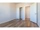 Bright bedroom featuring hardwood floors, a sliding door closet and neutral paint at 1135 Basalt Ridge Loop, Castle Rock, CO 80108