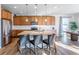 Well-lit kitchen with ample cabinet space and a stainless steel refrigerator, perfect for cooking enthusiasts at 1135 Basalt Ridge Loop, Castle Rock, CO 80108