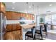Gourmet kitchen featuring a large island with seating, stainless steel appliances, and a dining area nearby at 1135 Basalt Ridge Loop, Castle Rock, CO 80108