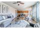 Open-concept living space with a view of the kitchen, creating a welcoming atmosphere at 1135 Basalt Ridge Loop, Castle Rock, CO 80108