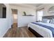 Bright main bedroom with ensuite access, a decorative shelf, and large windows providing natural light at 1135 Basalt Ridge Loop, Castle Rock, CO 80108