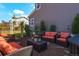 Inviting outdoor seating area with plush cushions, a fire pit, and tasteful landscaping at 1135 Basalt Ridge Loop, Castle Rock, CO 80108