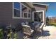 Cozy patio with outdoor seating, a grill, and access to the backyard at 1135 Basalt Ridge Loop, Castle Rock, CO 80108