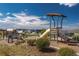 Community playground featuring a slide and various climbing structures at 1135 Basalt Ridge Loop, Castle Rock, CO 80108