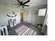 Cozy bedroom with playful decor, a ceiling fan, and a bright, inviting atmosphere at 9637 E 56Th Pl, Denver, CO 80238