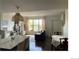 Inviting living space featuring a large window, dining area, and modern decor for comfortable living at 9637 E 56Th Pl, Denver, CO 80238