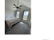 Bright main bedroom featuring high ceilings, natural light from two windows, and comfortable carpeting at 9637 E 56Th Pl, Denver, CO 80238