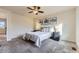 Bright carpeted bedroom features neutral walls, art decor and a ceiling fan at 25126 E Bayaud Pl, Aurora, CO 80018