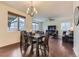 Bright dining room with hardwood floors, a chandelier, and lots of natural light at 25126 E Bayaud Pl, Aurora, CO 80018