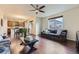 Open-concept living and dining area with hardwood floors and lots of natural light at 25126 E Bayaud Pl, Aurora, CO 80018