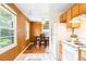 The kitchen has white tile floor, wood cabinets, and a view of the dining area at 4616 E Yale Ave, Denver, CO 80222