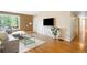 Inviting living room boasting hardwood floors, large windows, and stylish décor at 4616 E Yale Ave, Denver, CO 80222